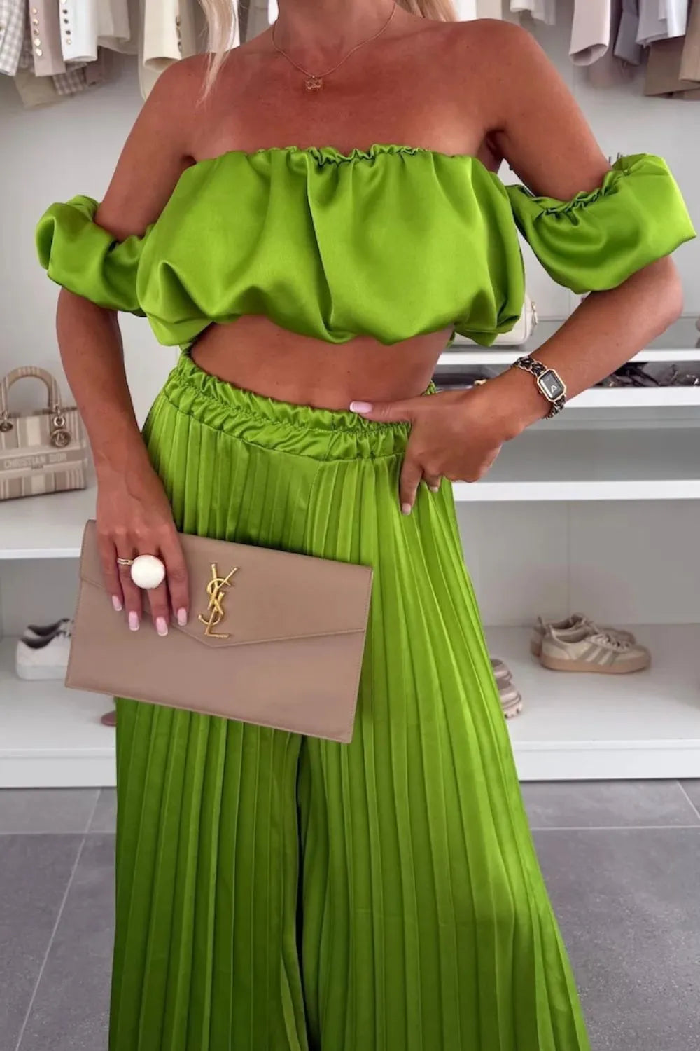 Green off-shoulder ruffled top and pleated pants two-piece set