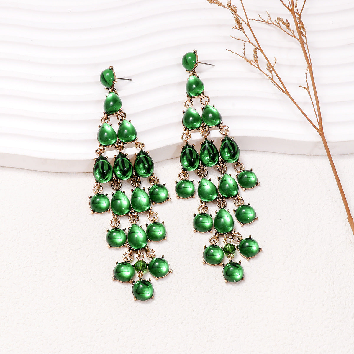Alloy and rhinestone teardrop chandelier earrings in green with gold-tone metal settings