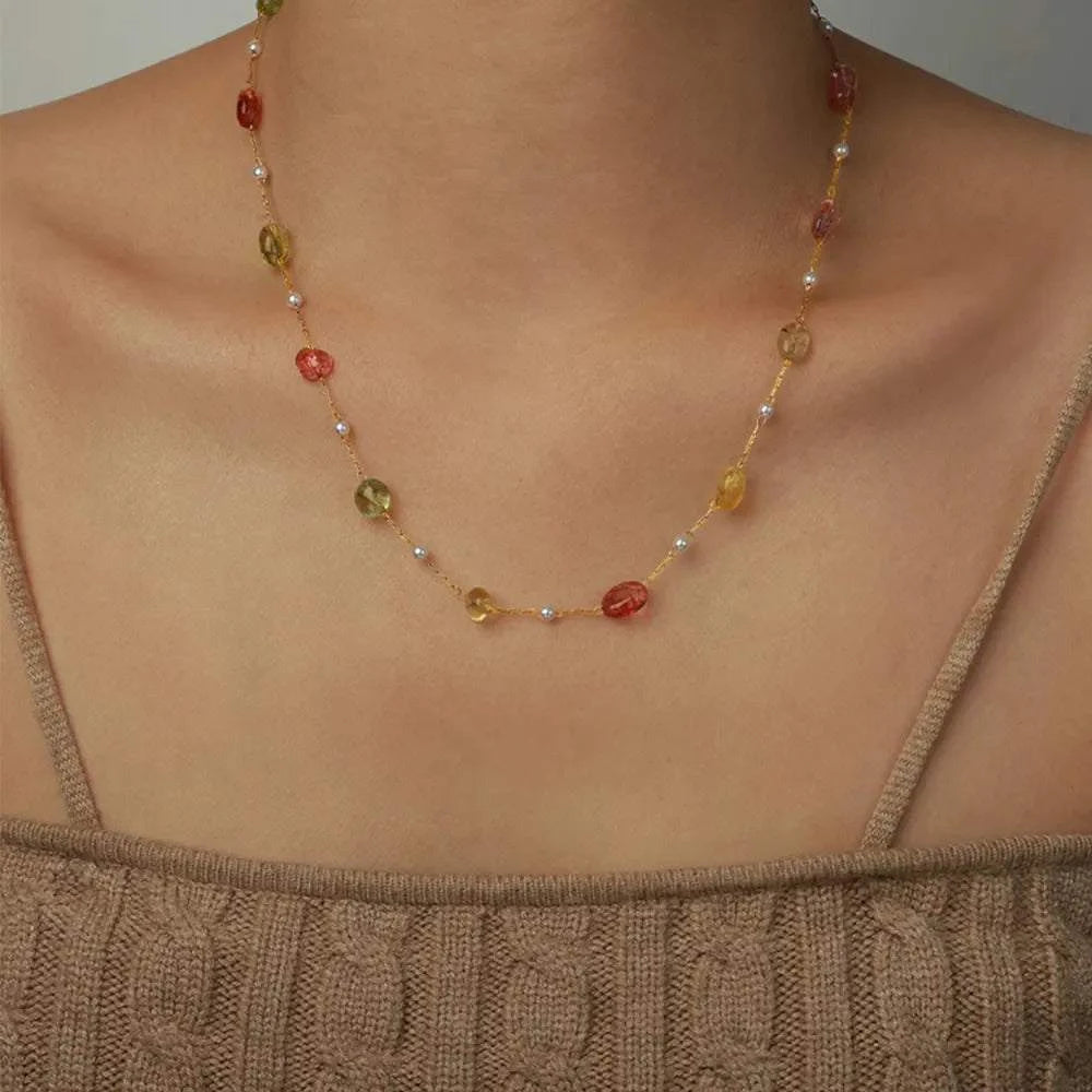 Titanium steel gold-plated bead necklace with synthetic pearls and natural stone beads on model's neck