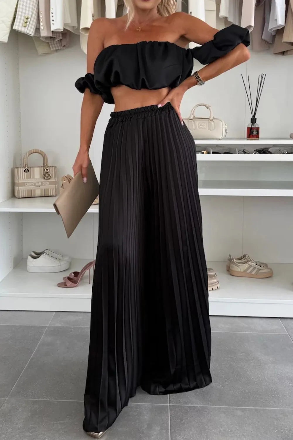 Black off-shoulder ruffled top with matching pleated wide-leg pants two-piece set