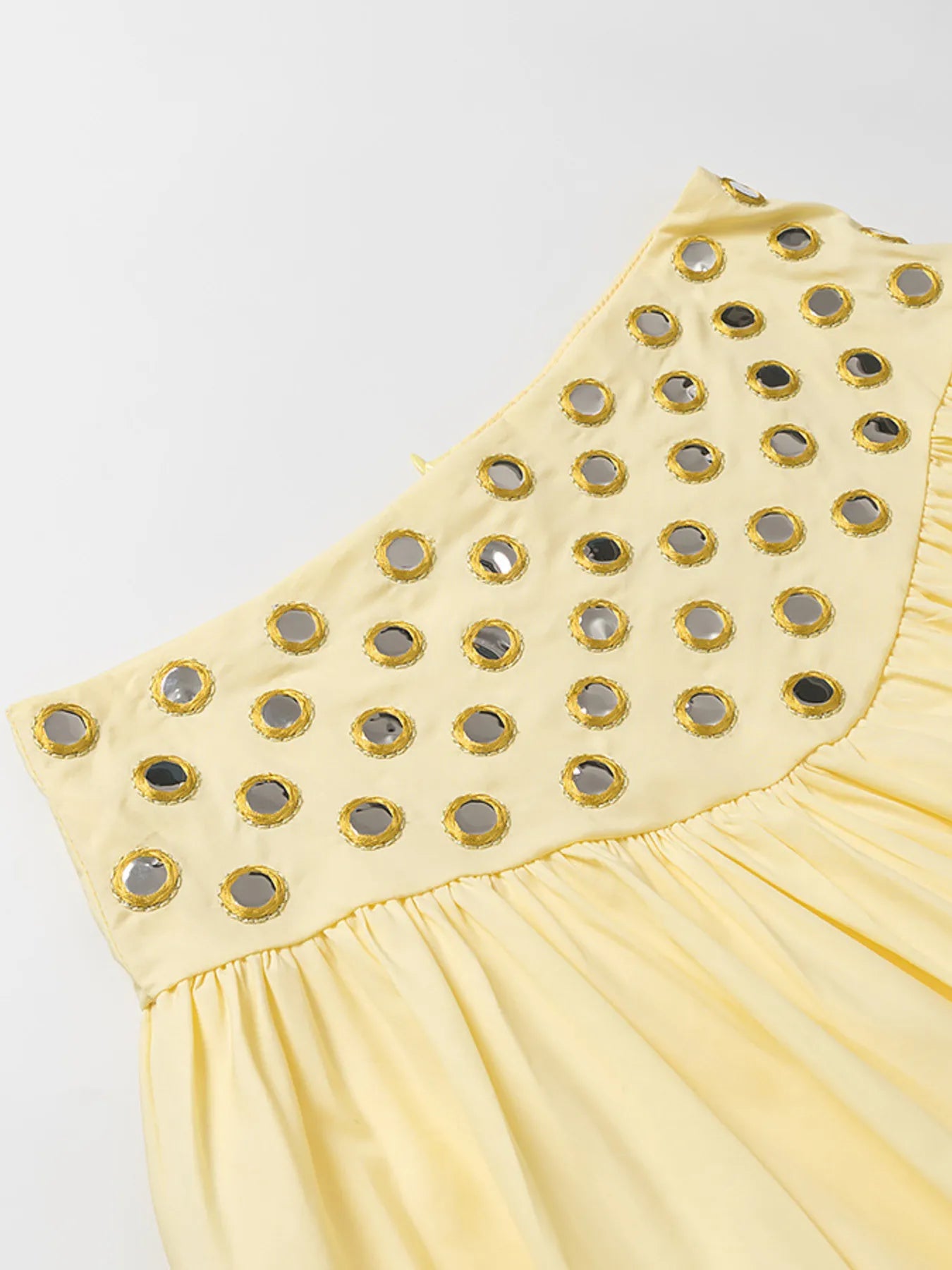 Yellow eyelet cami with cutout and ruffled detailing in polyester blend fabric