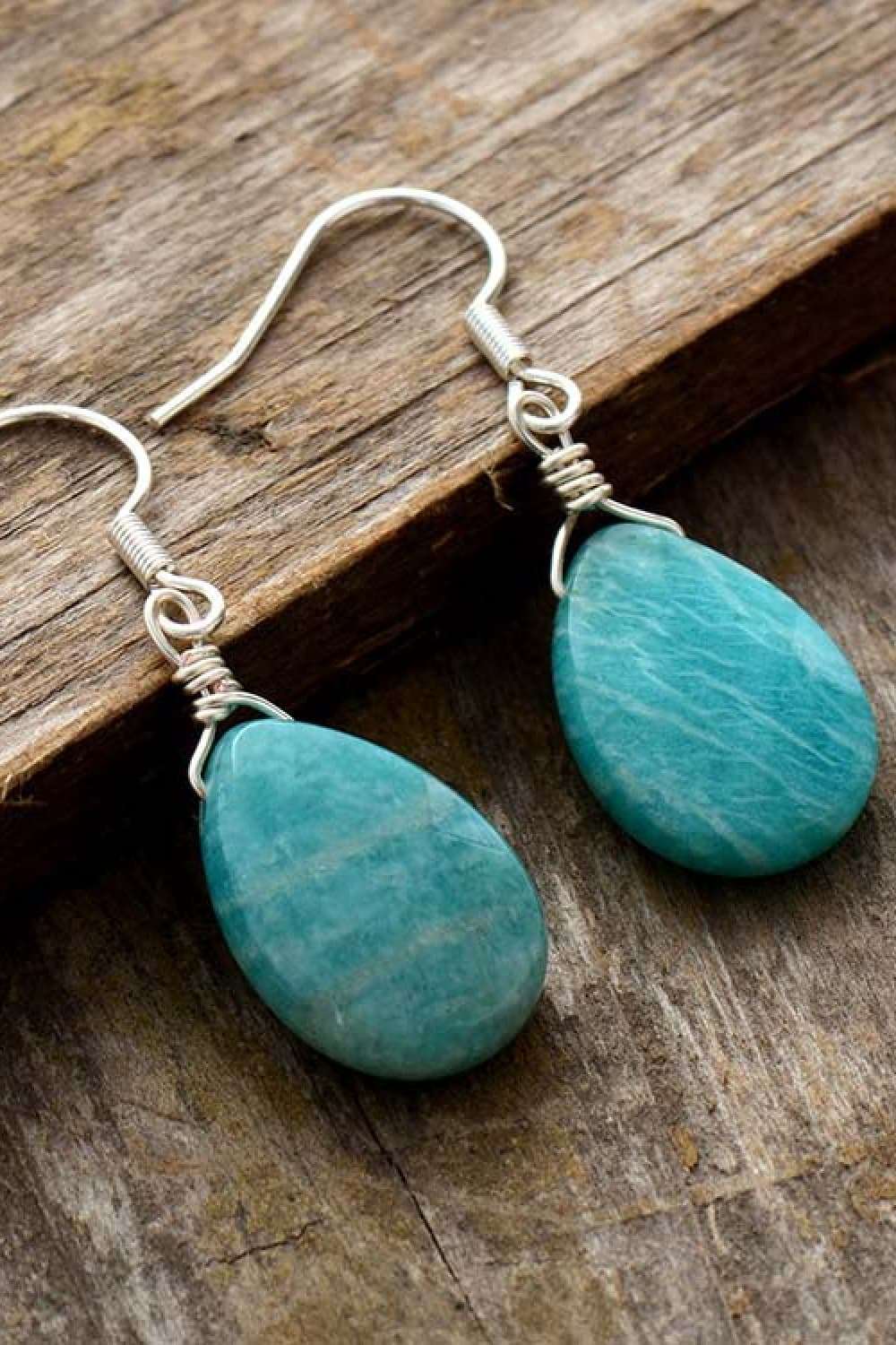 Handmade natural stone teardrop earrings with 925 silver hooks on wooden background