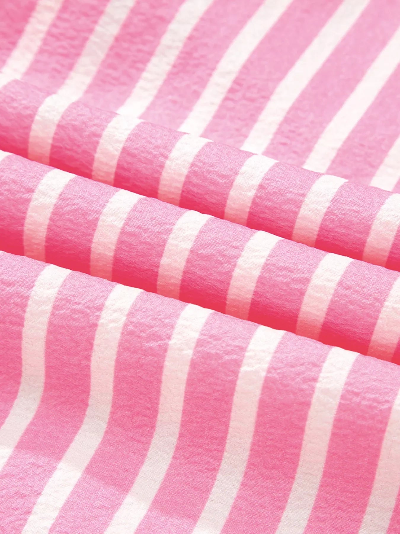 Close-up of pink and white striped fabric for Stripe Buttoned Front long sleeve top and pants sleepwear set