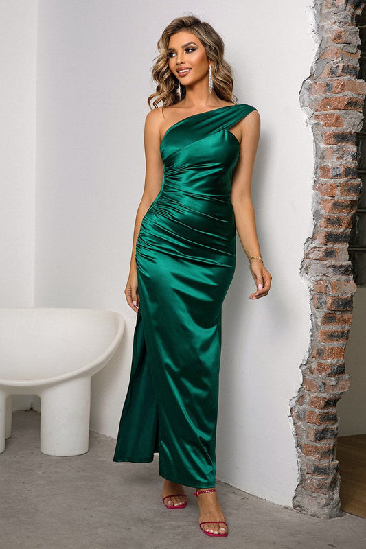 Woman wearing green one-shoulder ruched slit maxi dress with slight stretch and split detail