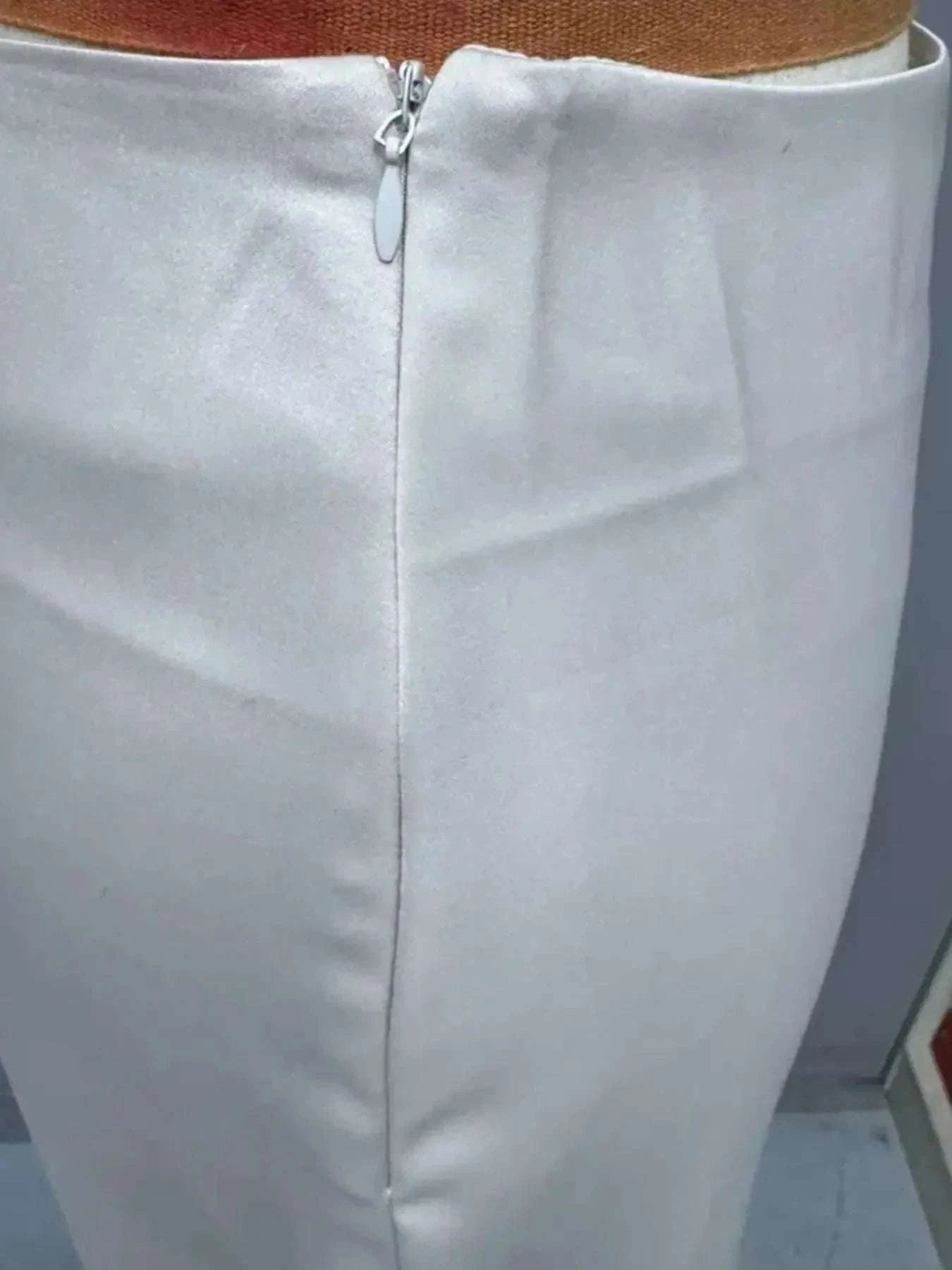 Asymmetric Midi Skirt with Fluted Hem.