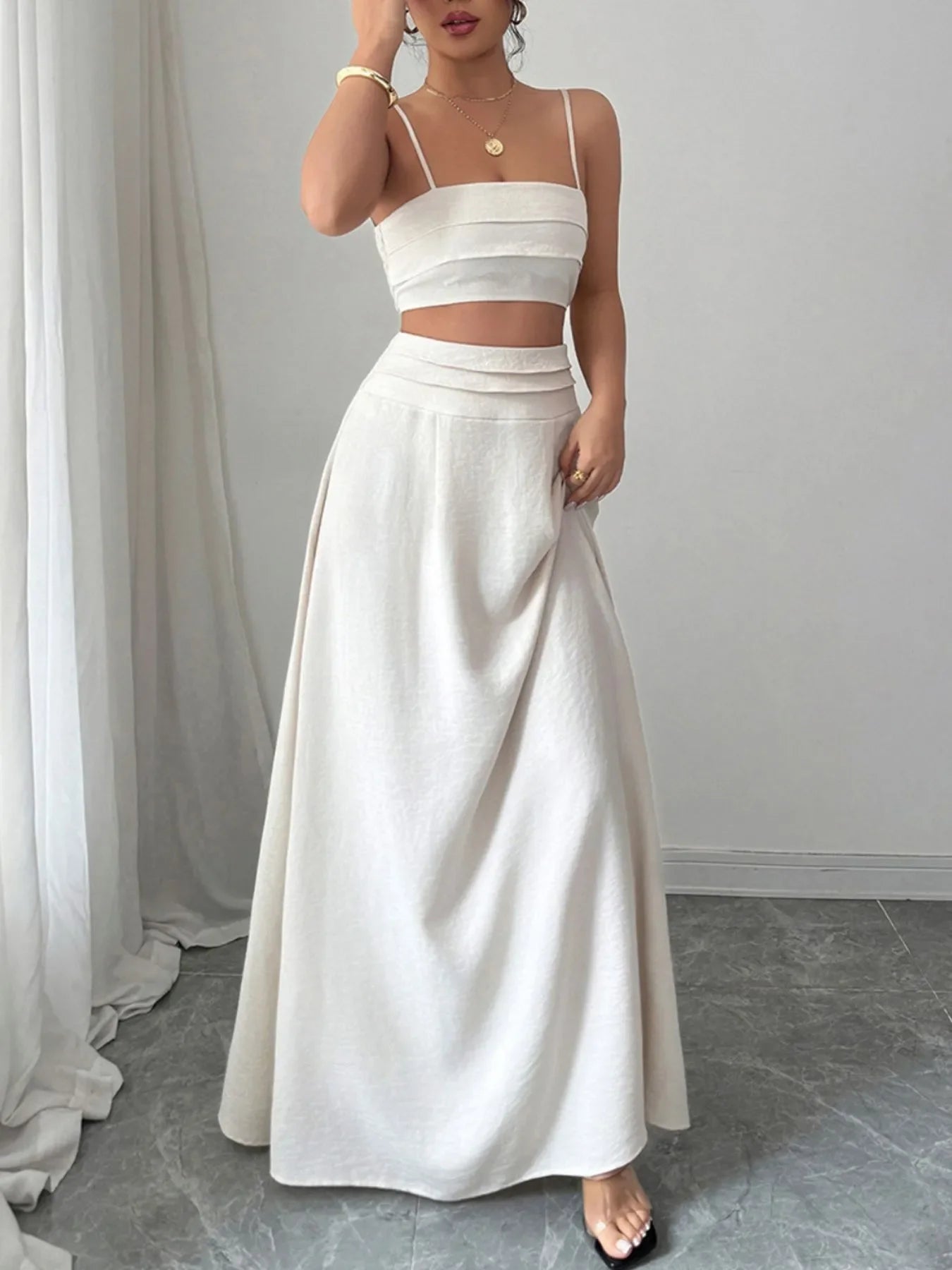 Woman wearing white square neck cami and maxi skirt two-piece set with ruched and smocked details