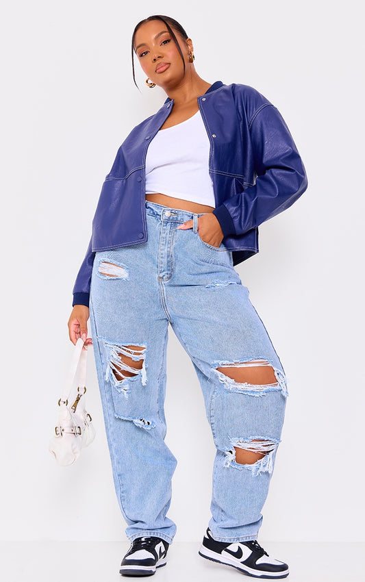 PRETTYLITTLETHING Plus Light Wash Ripped Mom Jeans.
