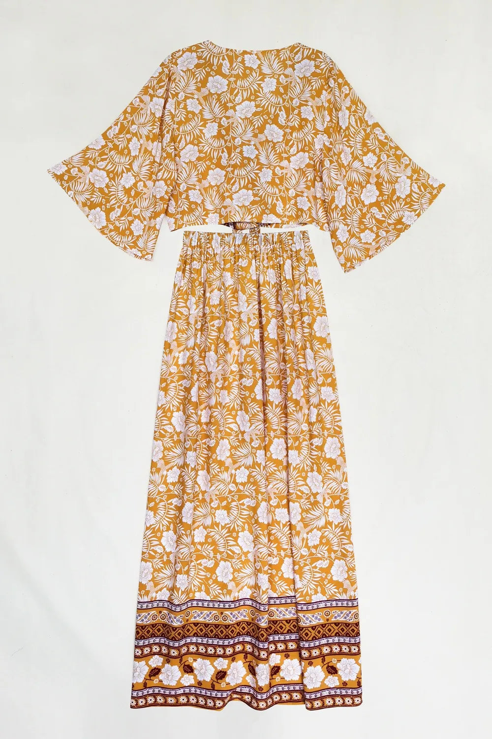 Printed half sleeve top and slit skirt set with floral design in orange and white, two-piece viscose outfit.