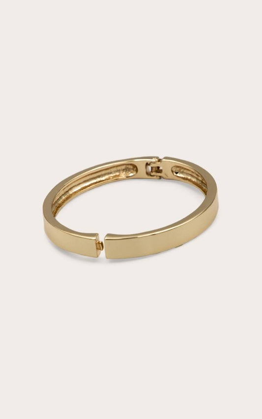 Gold chunky clasp bangle bracelet with sleek design for daytime accessories