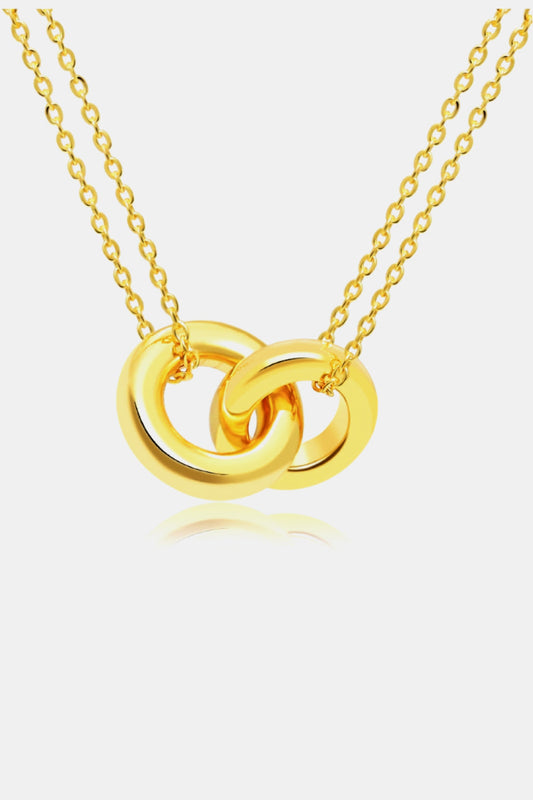 Elegant brass linked ring pendant necklace with 16.54-inch chain flat lay style