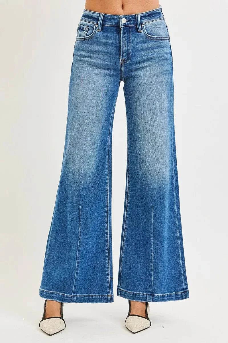 RISEN Full Size Mid Rise Wide Leg Jeans with Flared Look Plus SizeThese Mid Rise Wide Leg Jeans With Flared Look are a statement piece for a retro-inspired outfit. The mid rise waist provides a flattering fit and silhouette. The wiRISEN Full Size