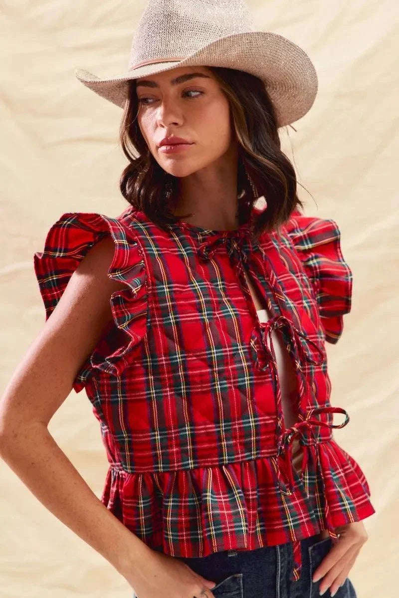 woman wearing Christmas holiday plaid ruffled quilt vest top with tied front and cowboy hat