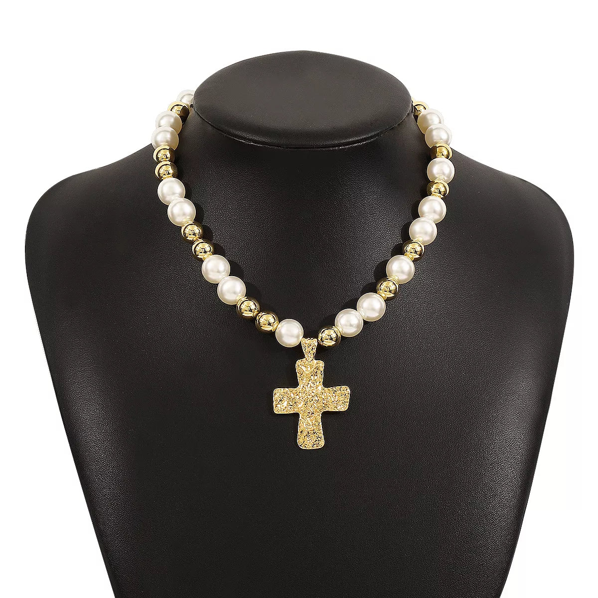 Pearl and cross pendant necklace with synthetic pearls and 18K gold-plated cross on black display bust