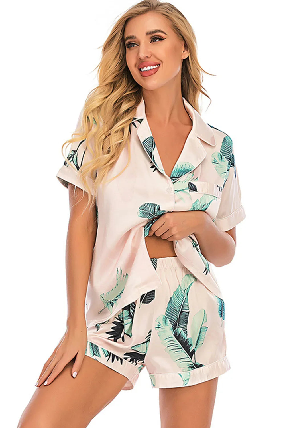 Printed button up short sleeve top and shorts lounge set with tropical leaf print on light fabric