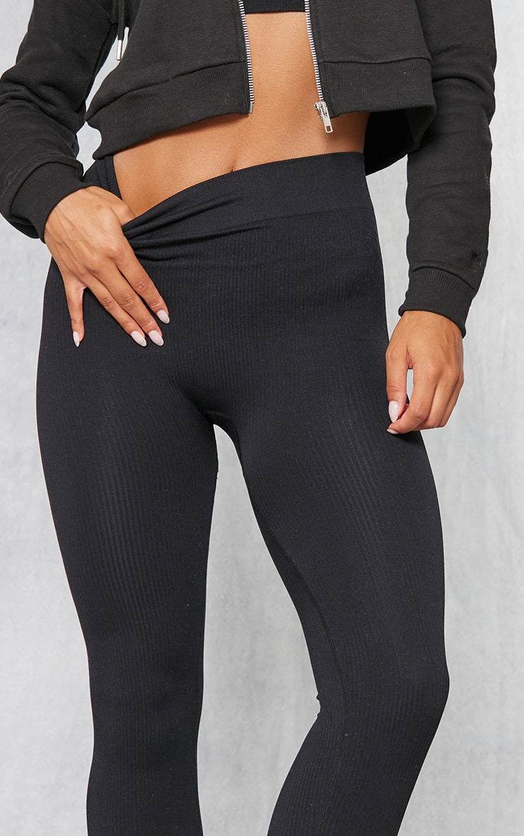 Black structured contour ribbed leggings with a high waist and sculpting fit
