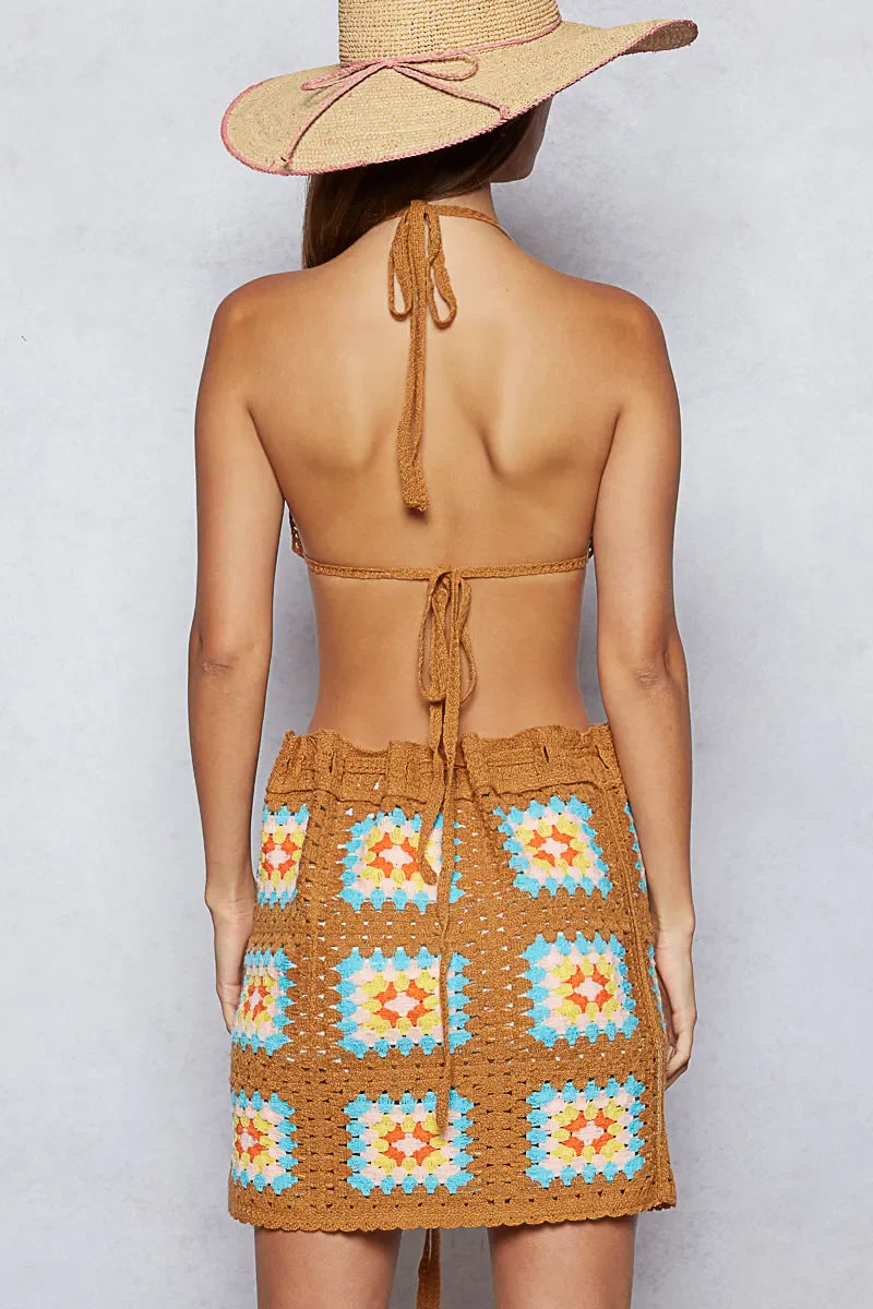 Back view of POL crochet halter neck cami and skirt sweater set in brown with colorful granny square pattern and adjustable ties