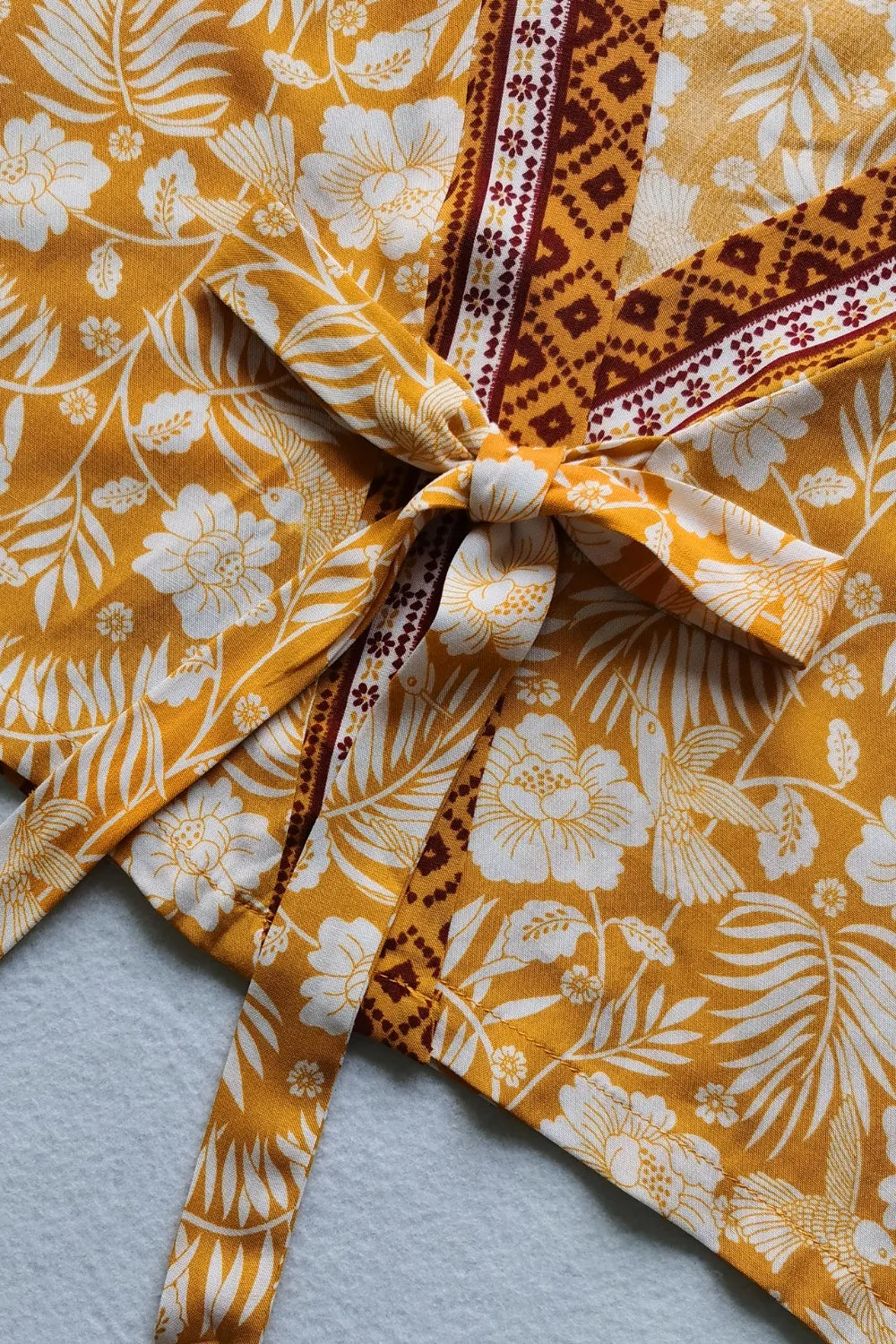 Printed half sleeve top and slit skirt set in yellow floral viscose fabric with bow detail