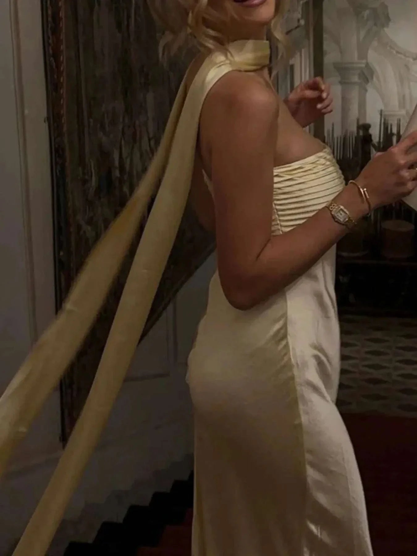 Elegant gold tube mermaid maxi dress with slit, zipper, and no stretch polyester fabric.