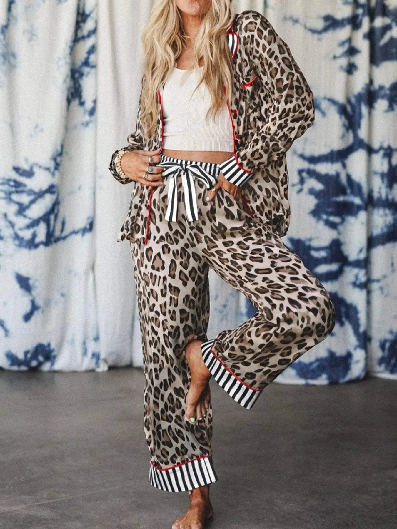 Woman wearing leopard and striped trim shirt and pants set with drawstring waist and pockets