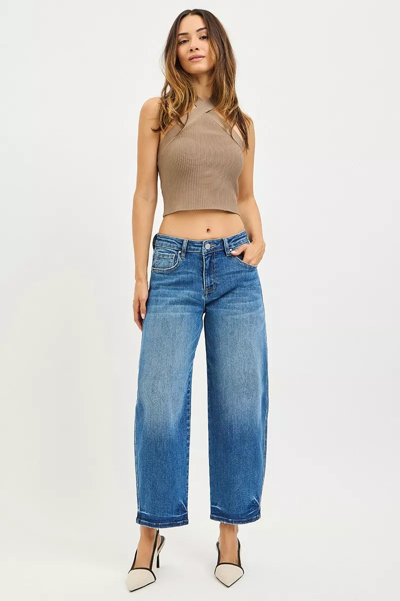 Woman wearing RISEN slouchy cropped barrel jeans with a relaxed fit and barrel leg design