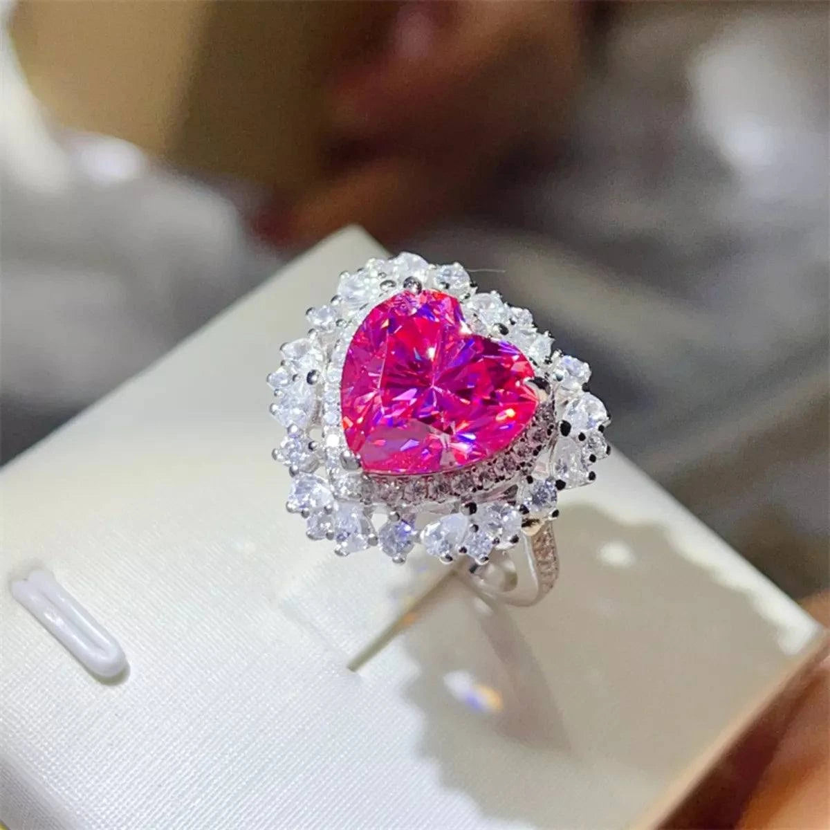 5 carat heart-shaped pink moissanite ring in 925 sterling silver with platinum plating and surrounding white stones