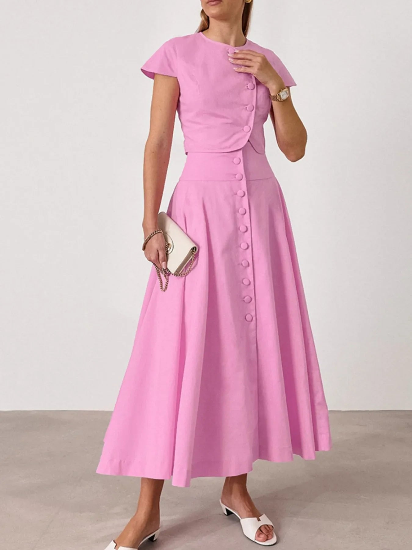 Women wearing pink short sleeve top and buttoned skirt set made of 100% cotton