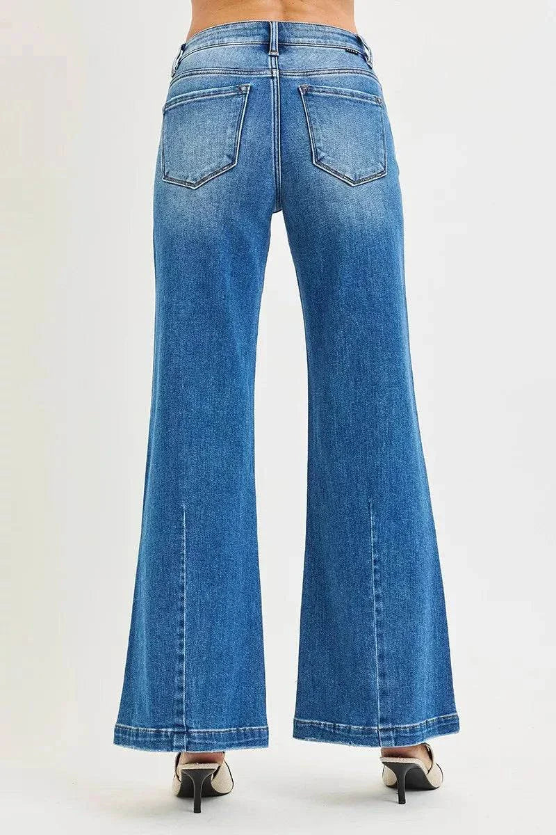 RISEN Full Size Mid Rise Wide Leg Jeans with Flared Look Plus SizeThese Mid Rise Wide Leg Jeans With Flared Look are a statement piece for a retro-inspired outfit. The mid rise waist provides a flattering fit and silhouette. The wiRISEN Full Size