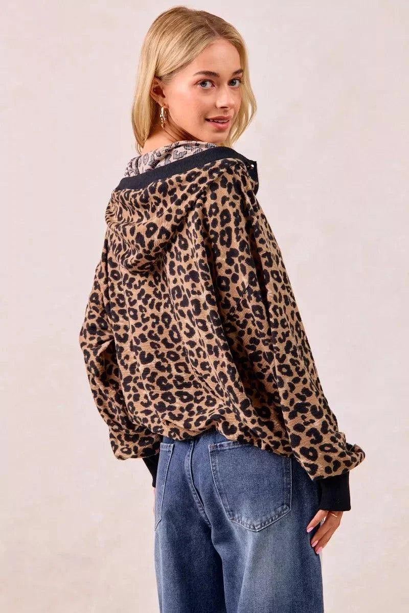 Leopard print waffle half zip hoodie with pocket worn by woman facing backward