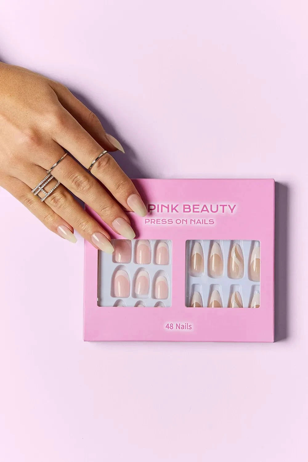 SO PINK BEAUTY press on nails two pack with 48 pieces and cute pink packaging on purple background