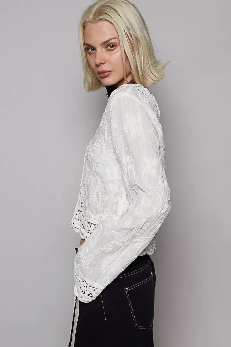 POL Long Sleeve Cropped Crochet Top with floral embroidery on model wearing black pants