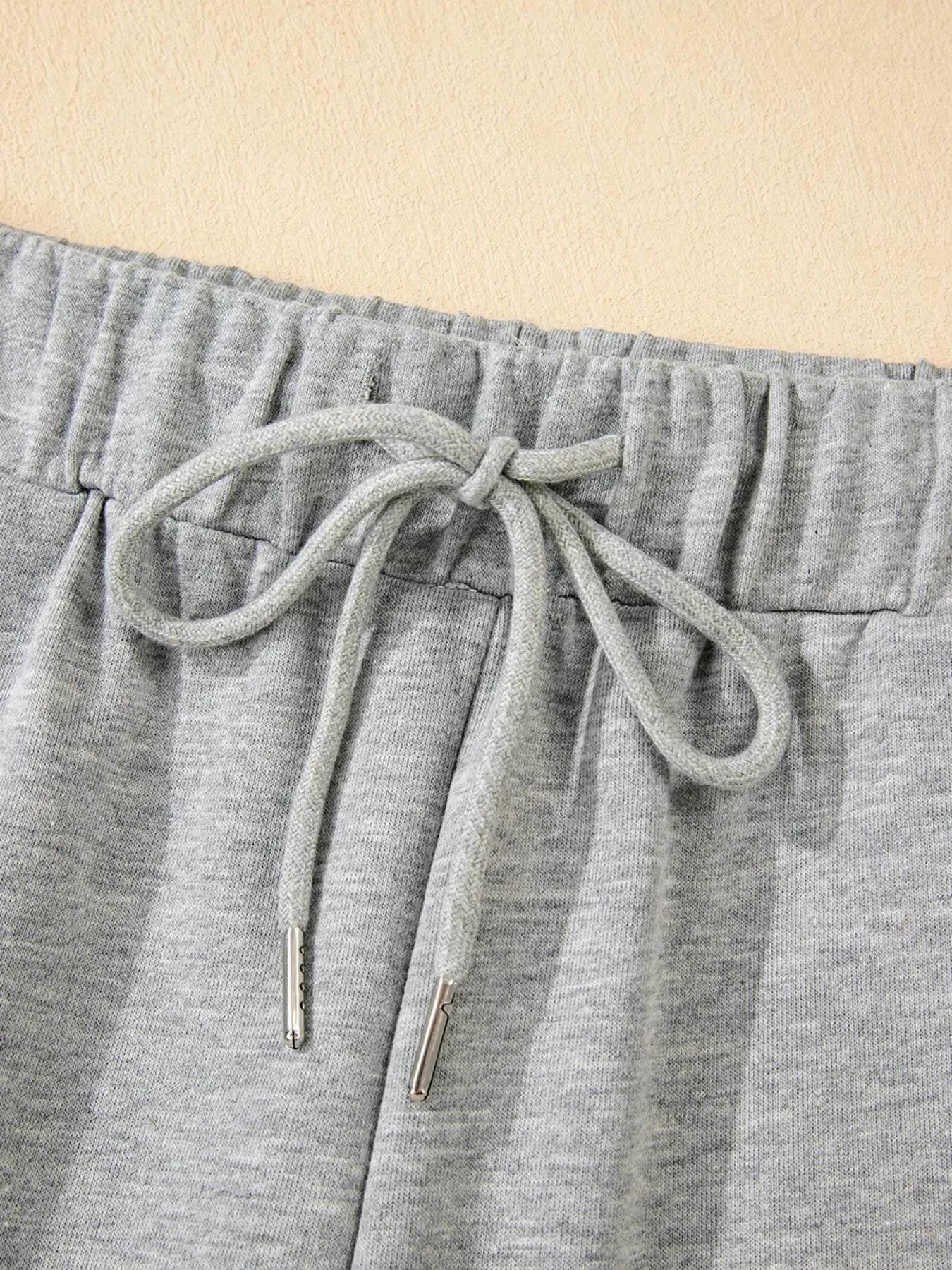 Close-up of gray drawstring waistband on Contrast Trim Round Neck Top and Pants Set