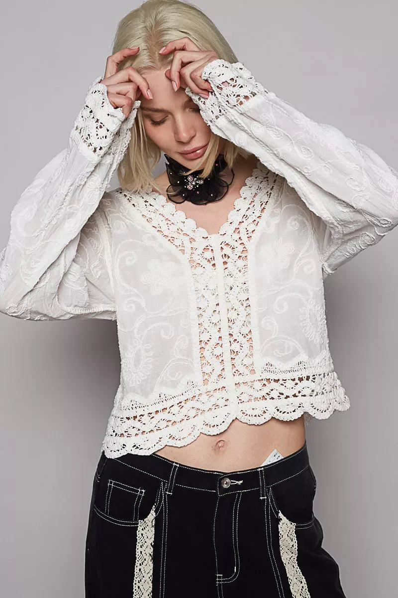 POL Long Sleeve Cropped Crochet Top with floral embroidery and intricate lace detailing in white, styled with black pants