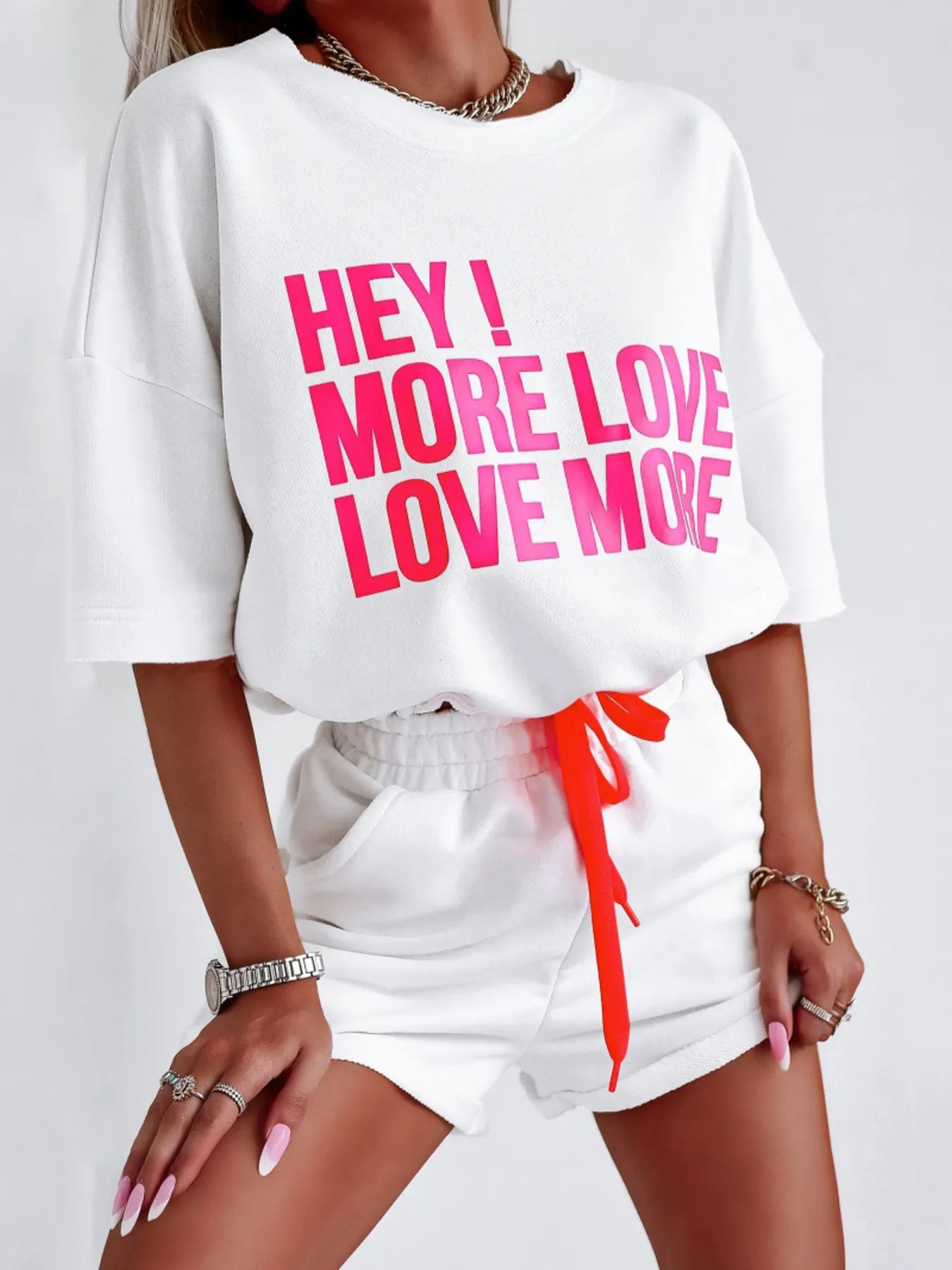 White letter graphic top and shorts set with pink text and red drawstring waistband