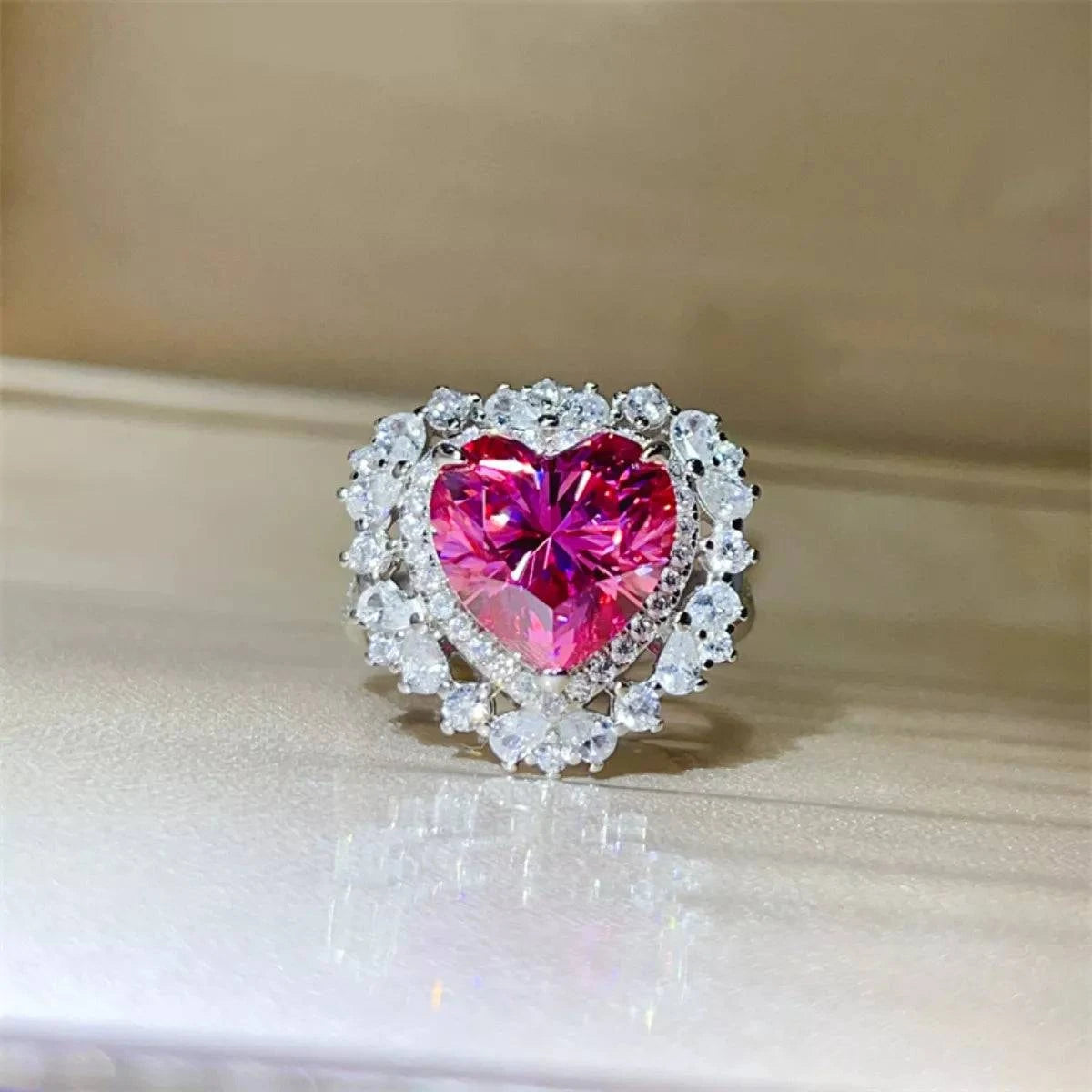 5 Carat heart-shaped pink moissanite ring in 925 sterling silver with platinum plating and surrounding clear stones