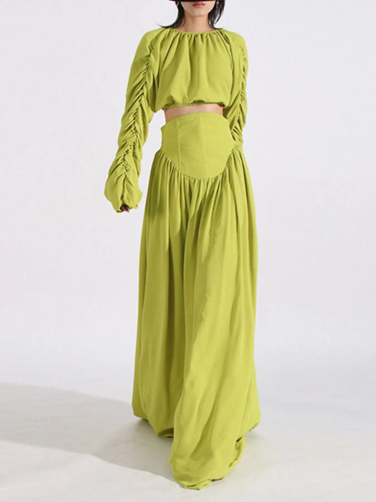 Green ruched long sleeve top and high waist skirt set with tied details, slightly stretchy polyester fabric.