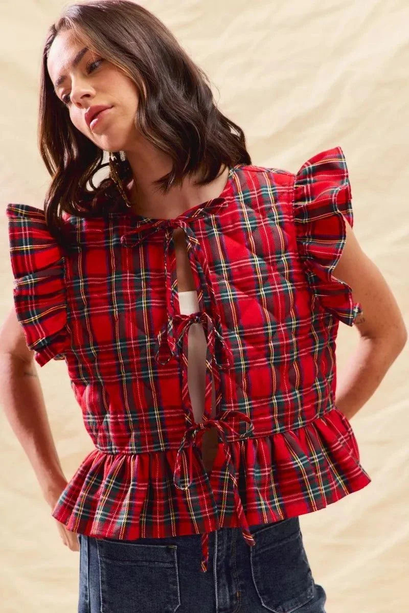 woman wearing red Christmas holiday plaid ruffled quilt vest top with tie front and flutter sleeves