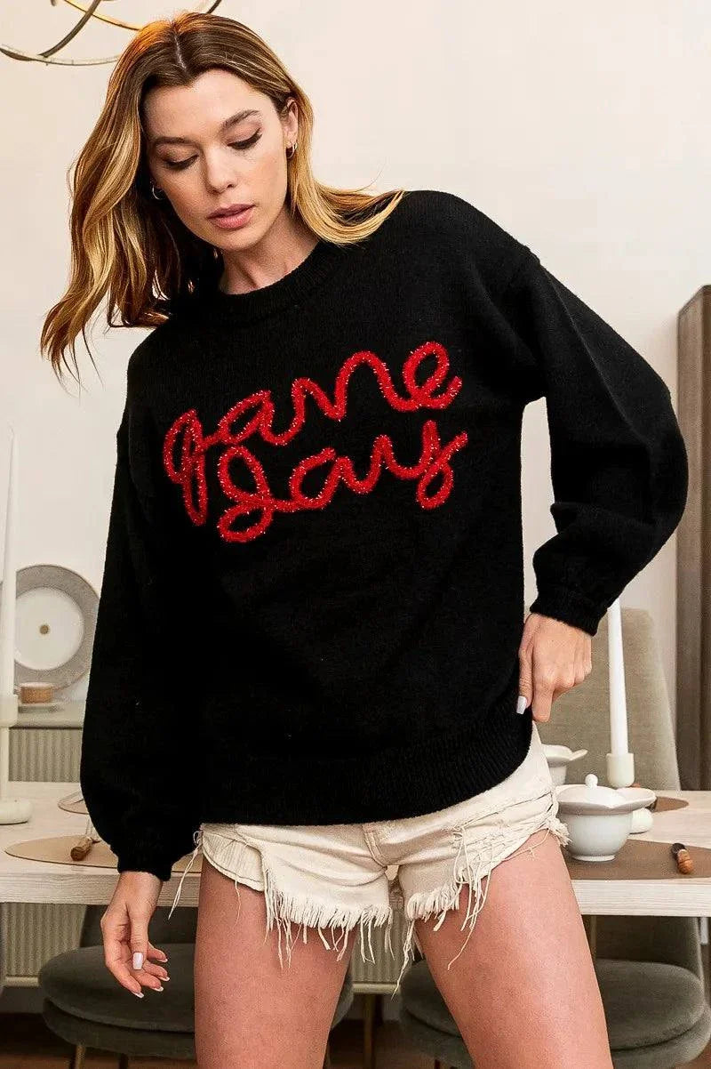BiBi Game Day Metallic Letter SweaterShow your team spirit in style with this Game Day Metallic Letter Sweater. The metallic letter design adds a touch of glamour and sparkle to this sweater, perfect foRedemption By Ashley NorthGame Day Metallic Letter Sweater