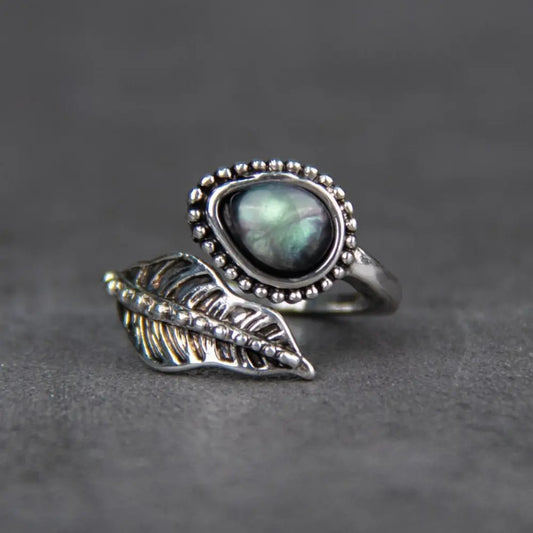 Alloy moonstone leaf bypass ring with teardrop-shaped stone and detailed leaf design
