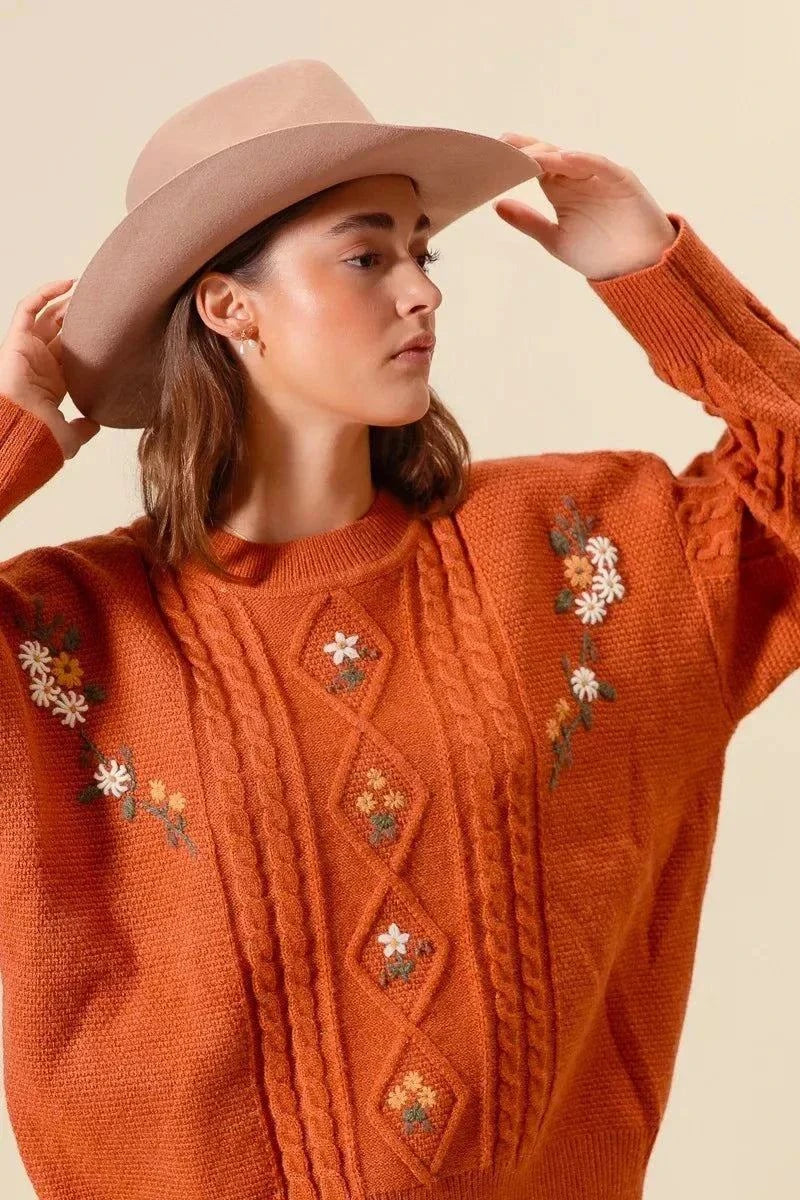 SO ME Embroidered Flower Cable Knitted SweaterElevate your winter wardrobe with this charming embroidered flower cable knitted sweater. The intricate floral embroidery adds a delicate and feminine touch to the cRedemption By Ashley NorthEmbroidered Flower Cable