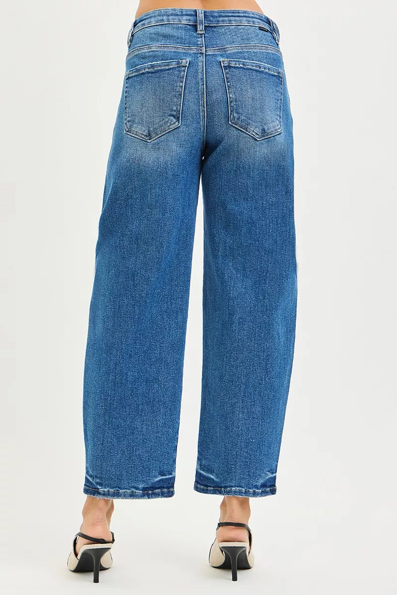 Back view of RISEN slouchy cropped barrel jeans in blue denim with pockets and a relaxed fit.