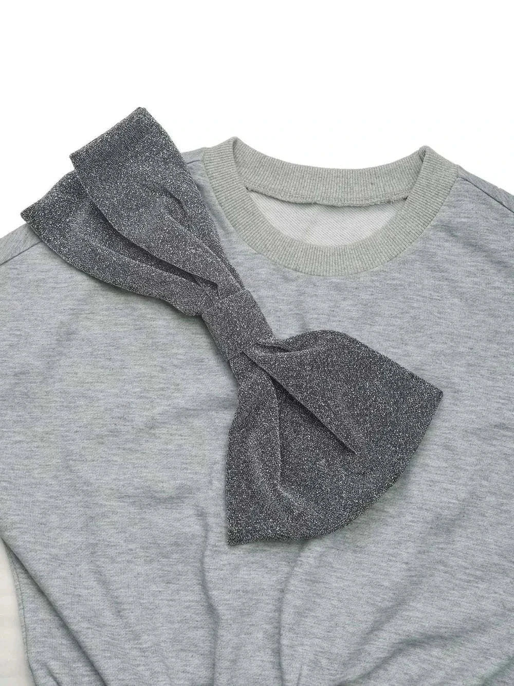 Close-up of grey Perfee Bow Mini Dress with large glittery bow and dropped shoulder design