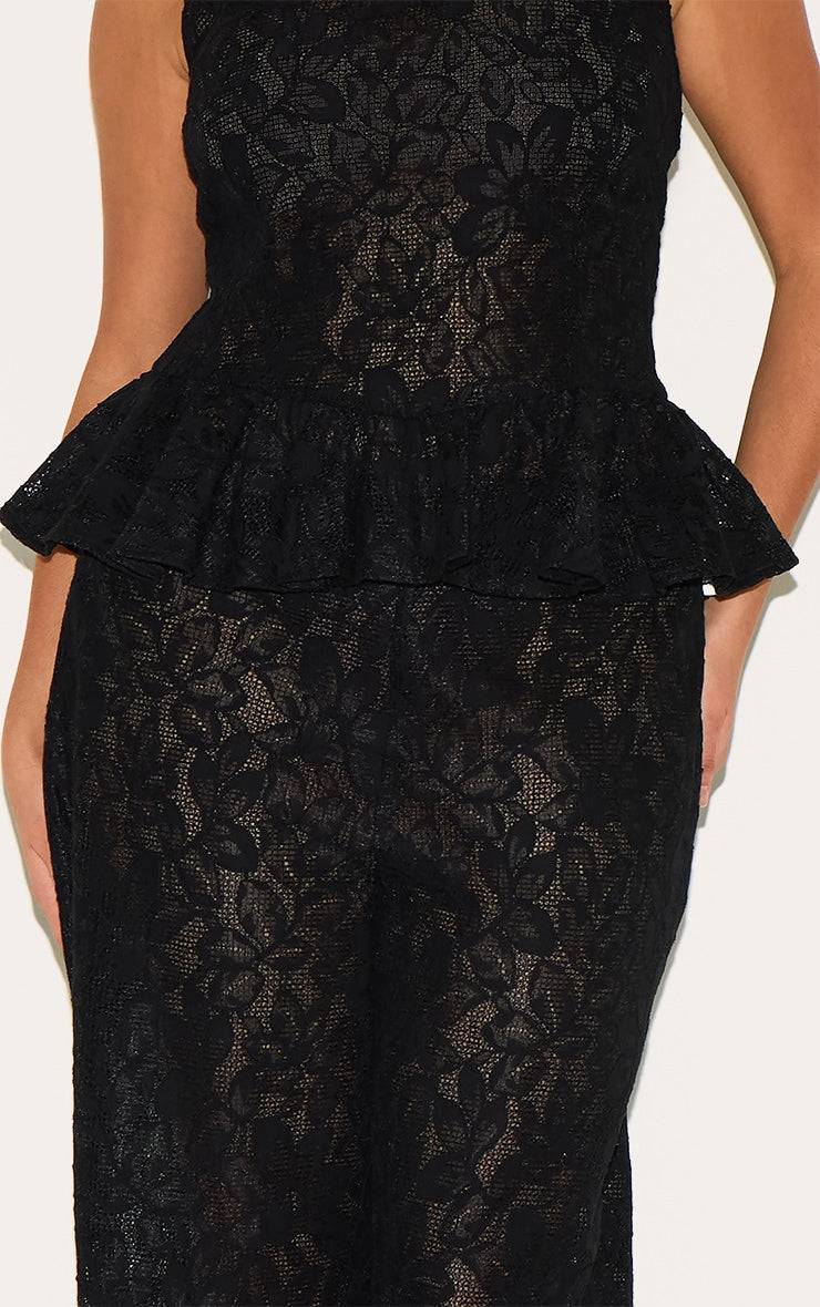 Plus Black Sheer Lace Flared Leg TrouserFinished with intricate detailing, these trousers are made from a black sheer lace material with a flattering flared high waisted fit. For the perfect co-ord, style Redemption By Ashley NorthPlus Black Sheer Lace