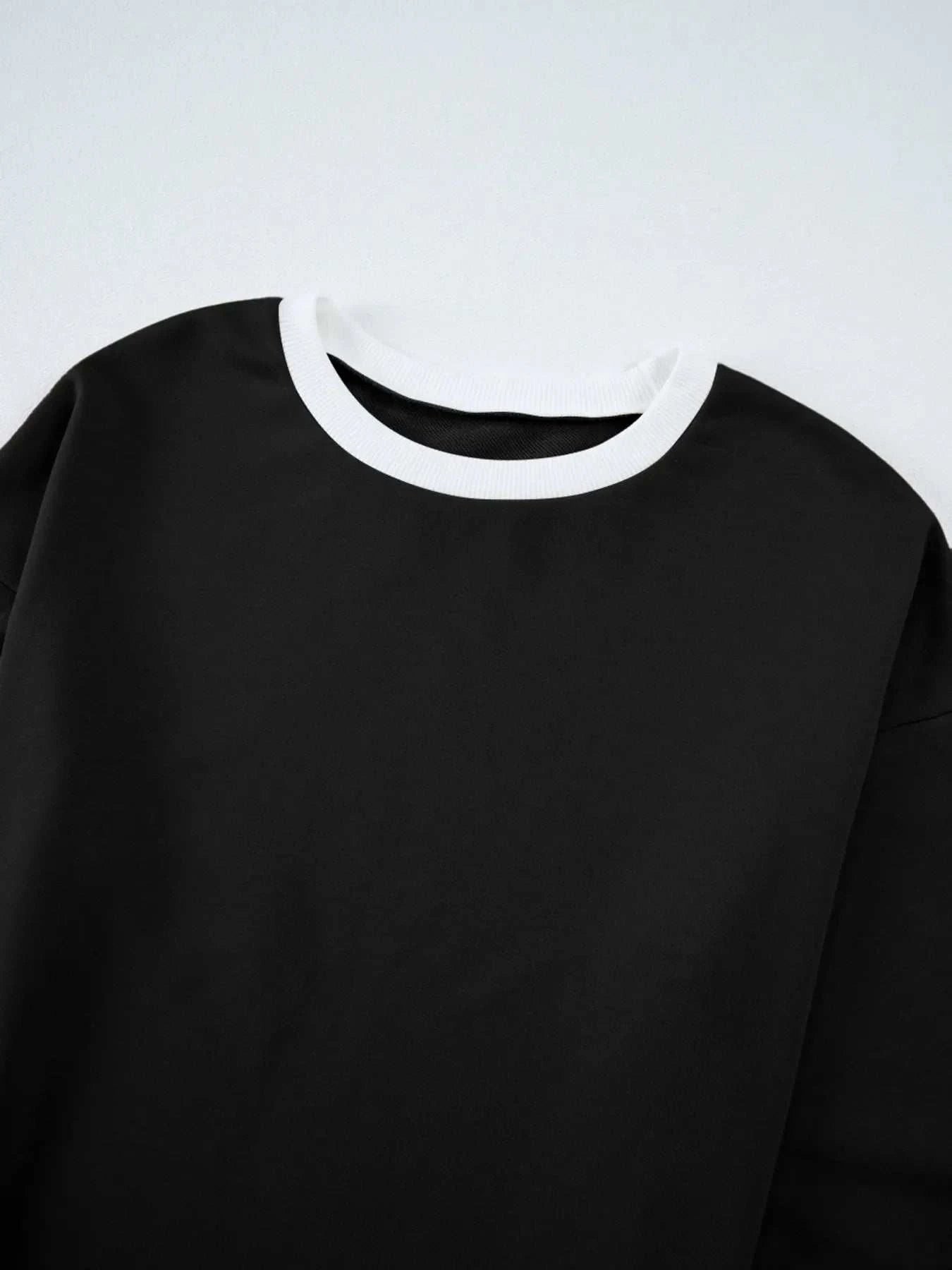 black Contrast Trim Round Neck Top with white trim and drawstring pants set, slightly stretchy polyester blend, machine washable