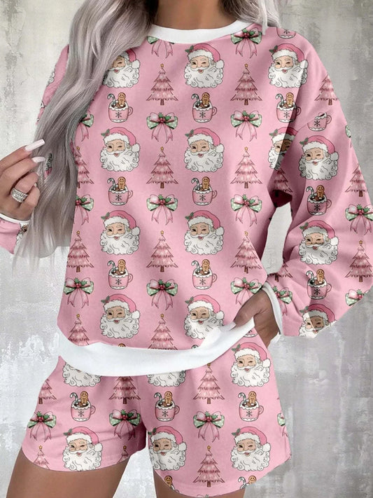 Christmas Santa Print pink two-piece lounge set with Santa faces, Christmas trees, and bows