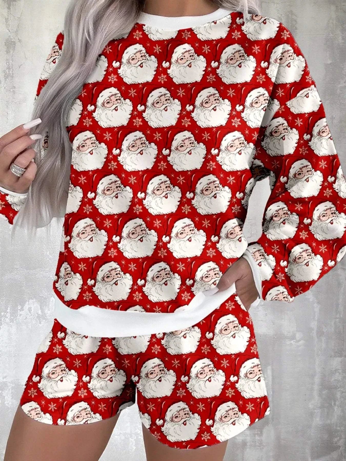 Christmas Santa Print round neck top and shorts lounge set with festive Santa faces on red background