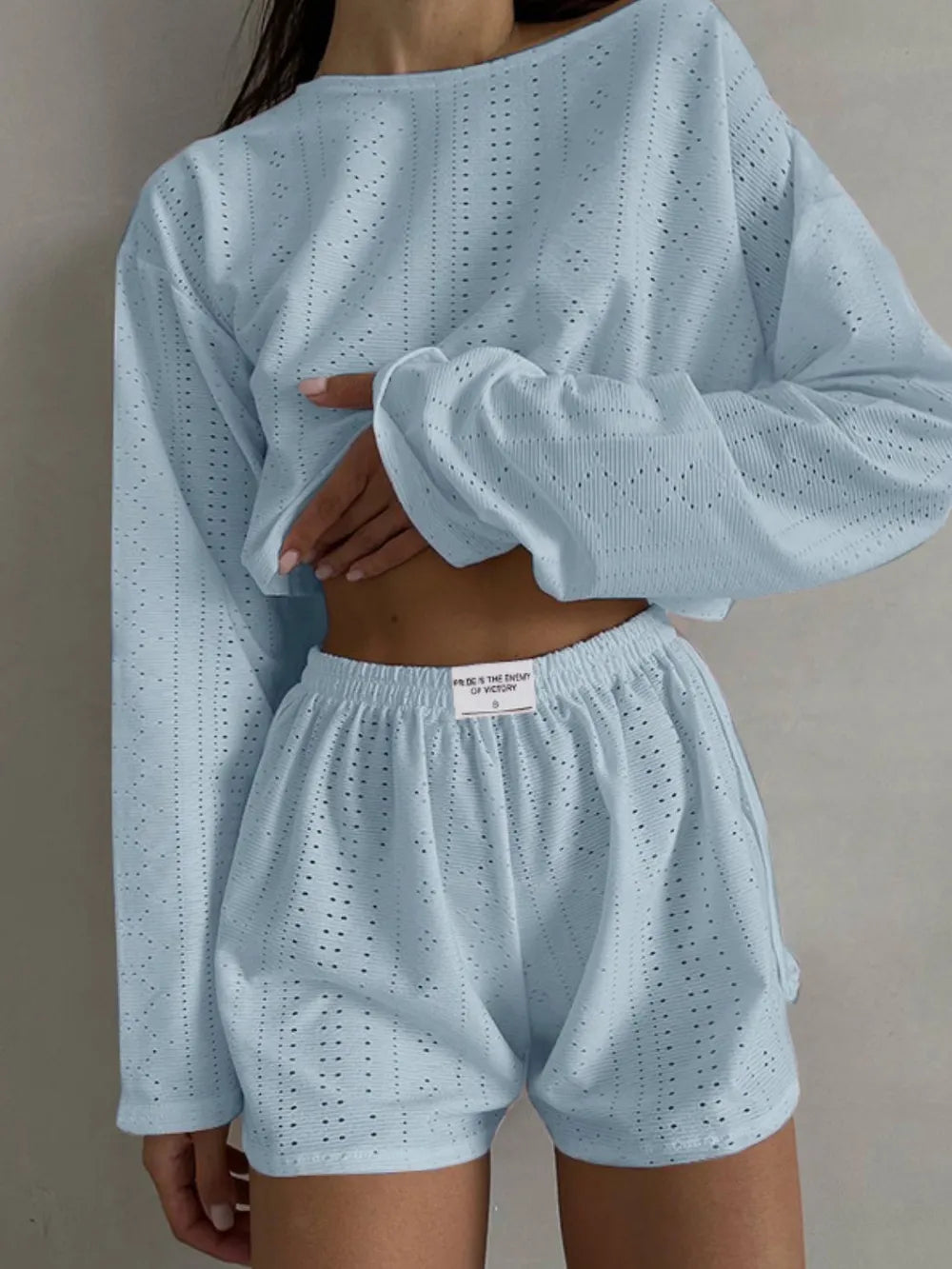 Light blue eyelet round neck top and matching shorts set with long sleeves and elastic waist, slightly stretchy polyester blend fabric