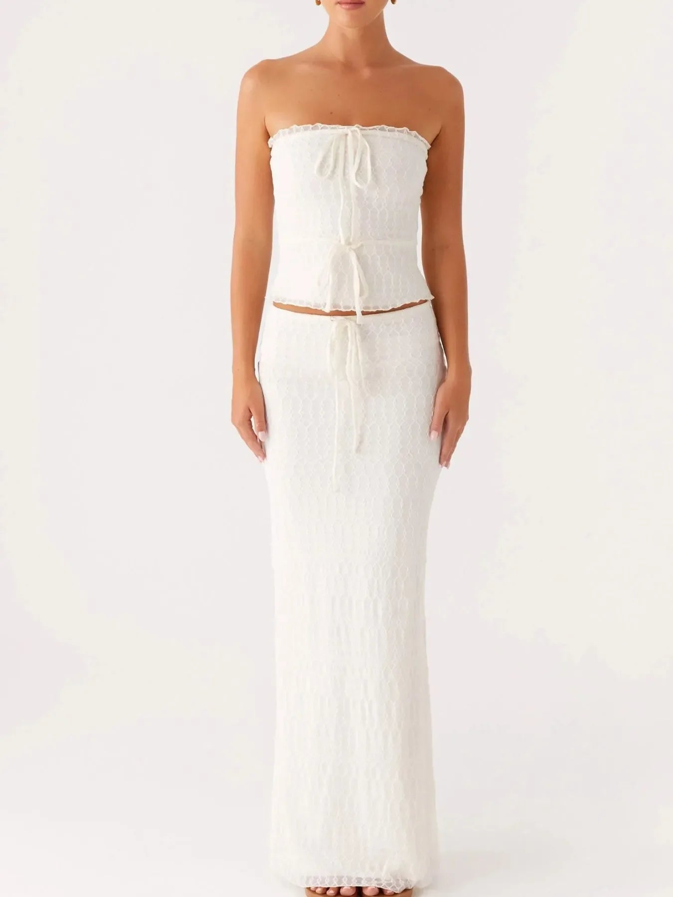 White tie front tube top and maxi skirt set with lace detail, slightly stretchy polyester fabric.