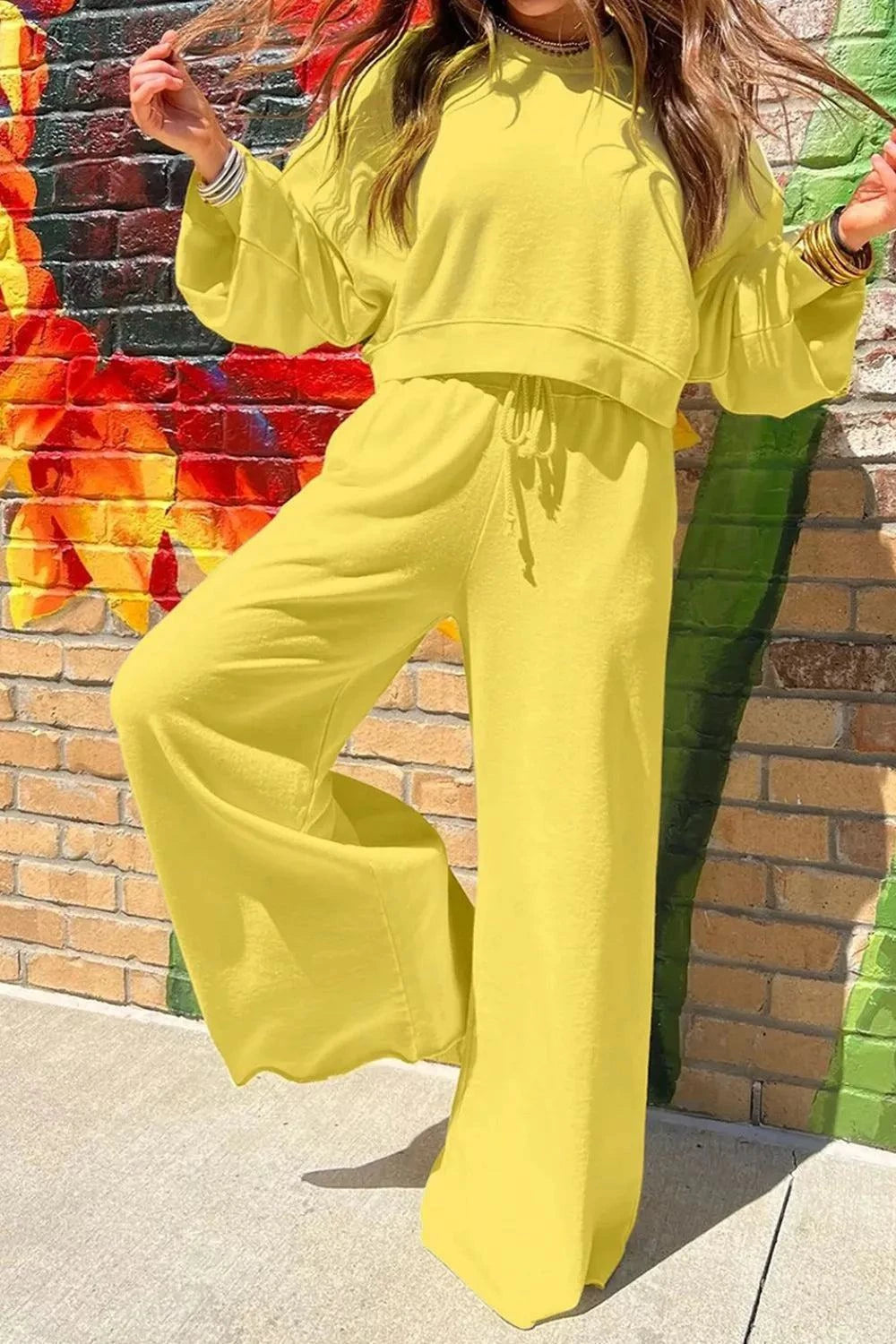 Yellow round neck long sleeve sweatshirt and wide-leg pants set for women