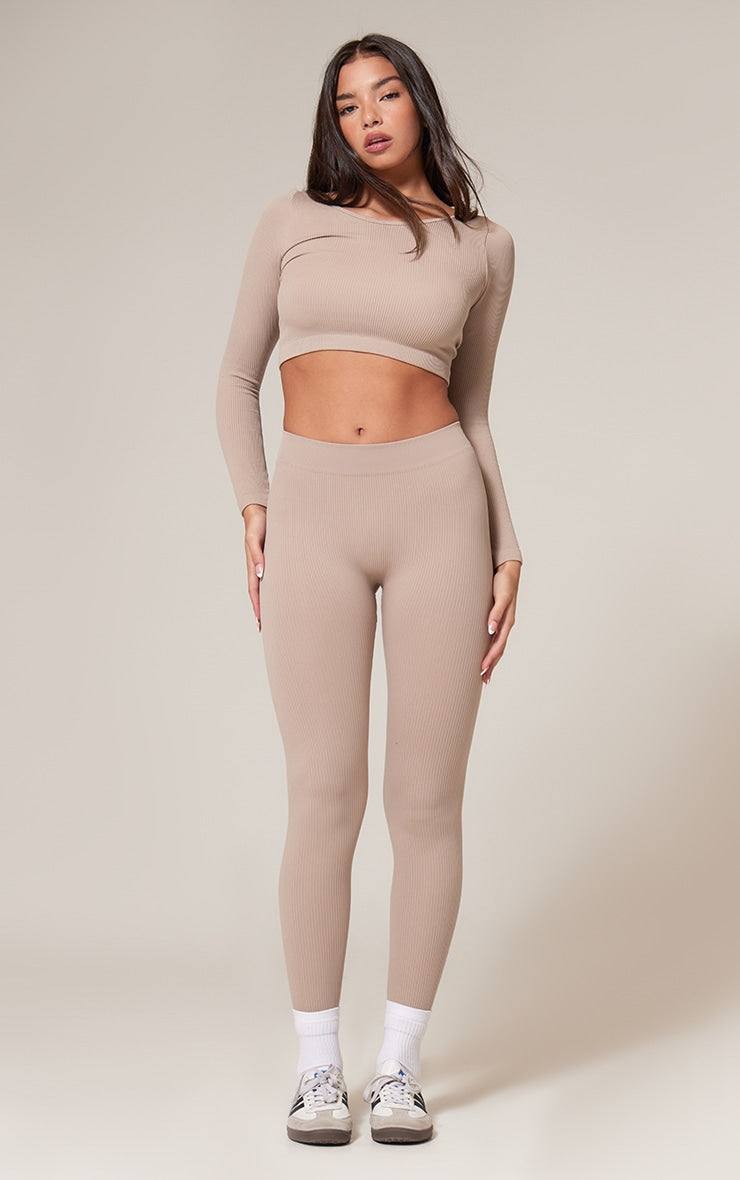 Black structured contour ribbed leggings for a sculpted silhouette, perfect for casual and chic looks