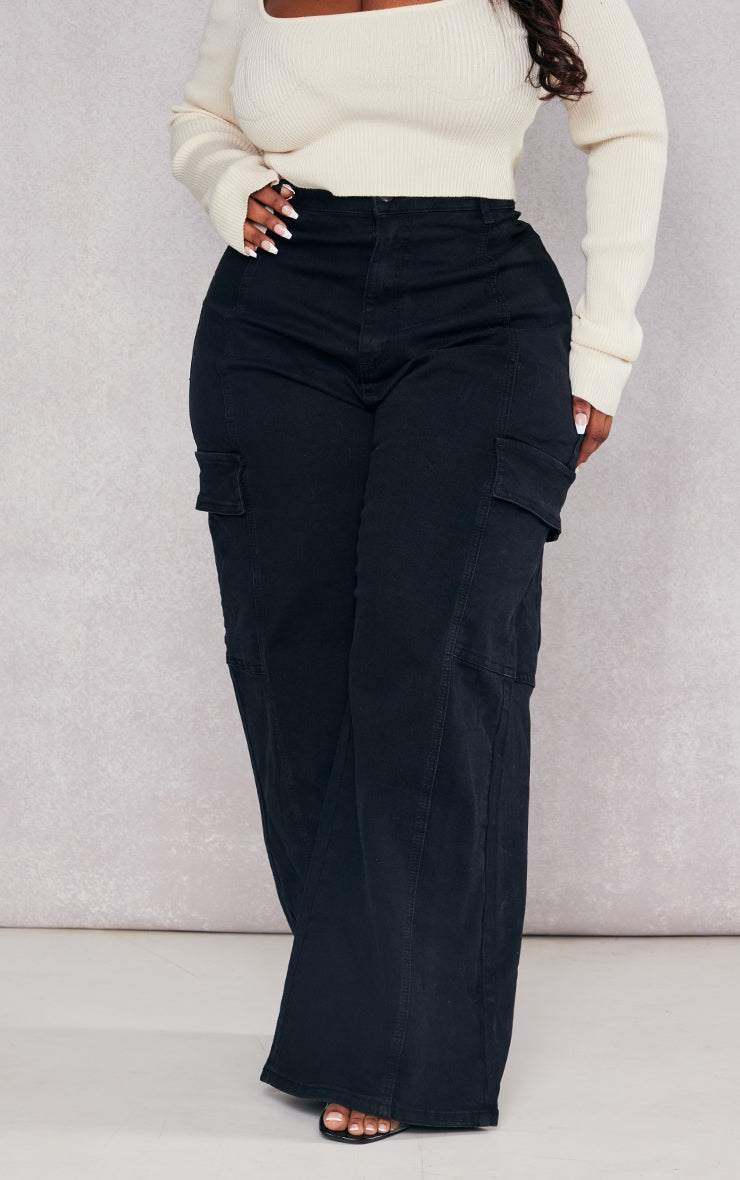 Plus Black Cargo Wide Leg JeansReimagine utilitarian style with these black, wide-leg cargo jeans. Cut from durable denim, these jeans offer a contemporary take on a classic silhouette. The multipRedemption By Ashley NorthPlus Black Cargo